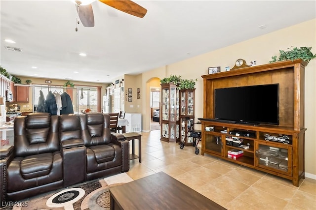 2612 Tullamore Creek Ln, Laughlin, NV 89029 - living area featuring arched walkways, ceiling fan, and light tile patterned floors