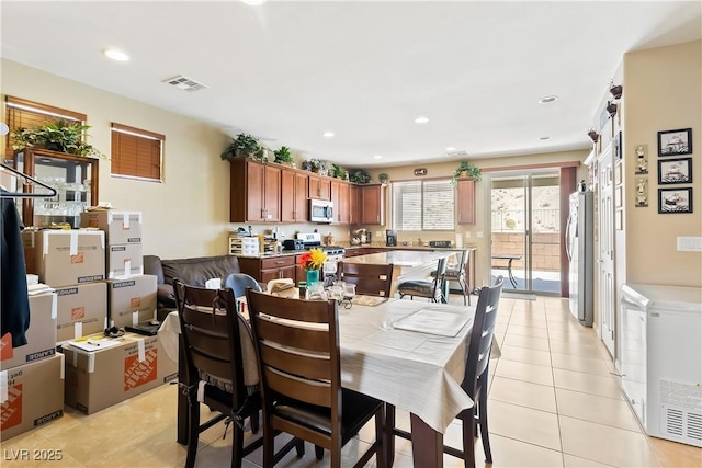 2612 Tullamore Creek Ln, Laughlin, NV 89029 - dining space featuring light tile patterned flooring and recessed lighting