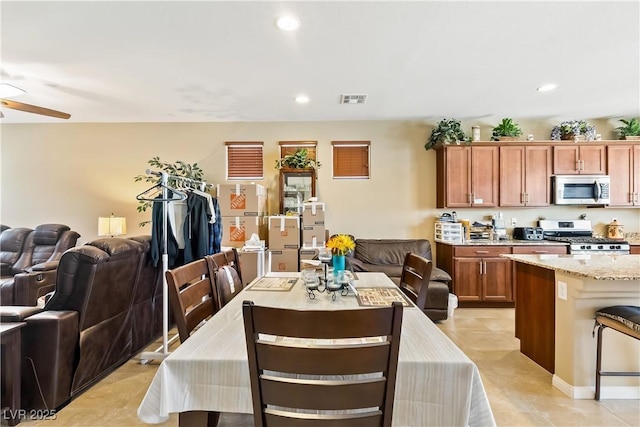 2612 Tullamore Creek Ln, Laughlin, NV 89029 - dining room with a ceiling fan, recessed lighting, and light tile patterned floors