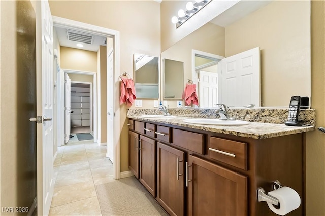 2612 Tullamore Creek Ln, Laughlin, NV 89029 - bathroom featuring tile patterned flooring, double vanity, and baseboards