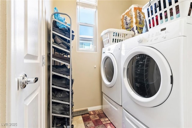 2612 Tullamore Creek Ln, Laughlin, NV 89029 - washroom featuring washing machine and clothes dryer and baseboards
