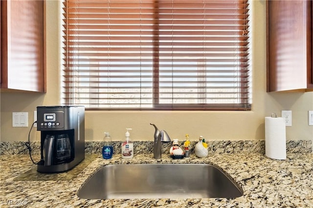 2612 Tullamore Creek Ln, Laughlin, NV 89029 - kitchen view of a sink and light stone counters