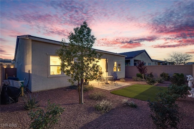 8944 Skye Canyon Ranch St, Las Vegas, NV 89166 - back of house featuring fence, a patio area, and stucco siding
