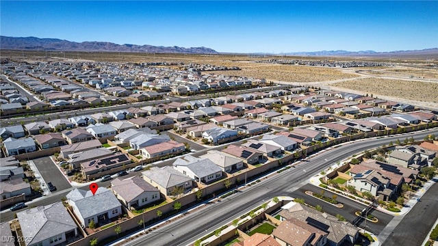 8944 Skye Canyon Ranch St, Las Vegas, NV 89166 - aerial view of property's location featuring a mountain backdrop and nearby suburban area