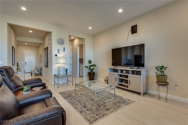 8944 Skye Canyon Ranch St, Las Vegas, NV 89166 - living room with recessed lighting, baseboards, light tile patterned floors, and washer / clothes dryer