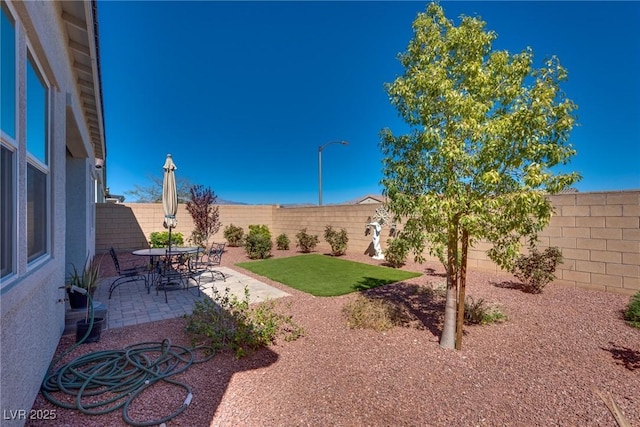 8944 Skye Canyon Ranch St, Las Vegas, NV 89166 - fenced backyard with a patio