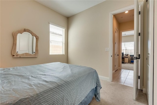 8944 Skye Canyon Ranch St, Las Vegas, NV 89166 - bedroom with light colored carpet, light tile patterned flooring, and baseboards