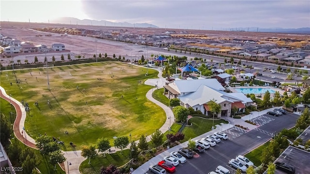 8944 Skye Canyon Ranch St, Las Vegas, NV 89166 - aerial perspective of suburban area featuring a mountain backdrop and a pool