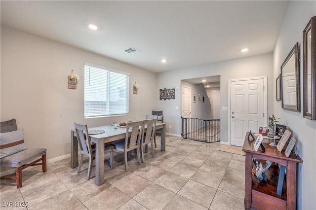 dining space featuring baseboards, visible vents, and recessed lighting