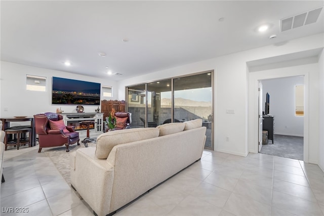 10216 Chrysolite Pl, Las Vegas, NV 89143 - living area featuring light tile patterned flooring, baseboards, and recessed lighting