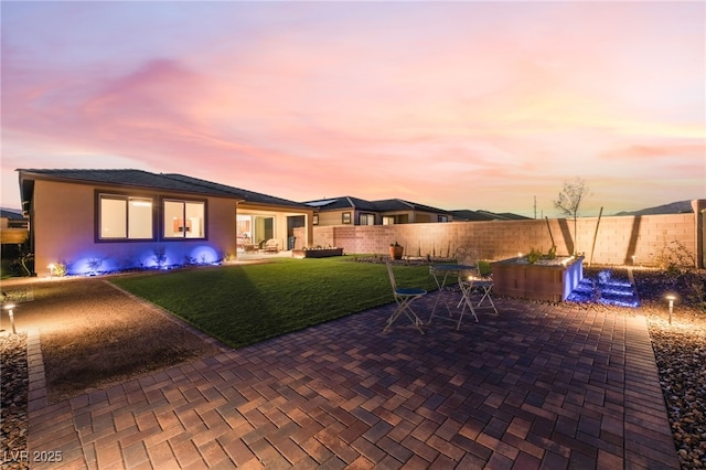 10216 Chrysolite Pl, Las Vegas, NV 89143 - patio terrace at dusk featuring a patio and outdoor dining space