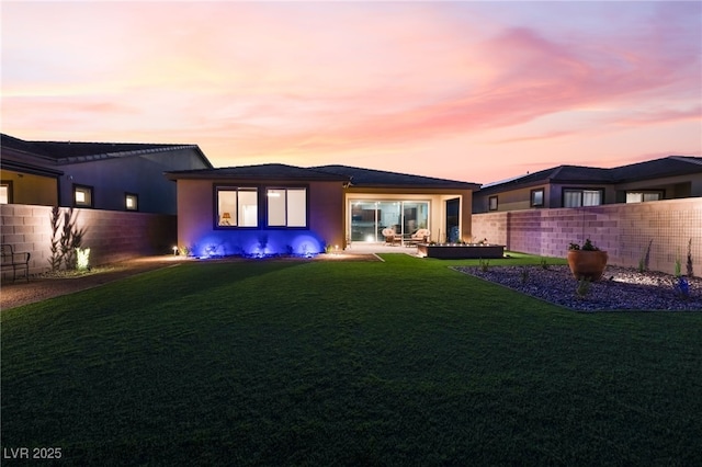 10216 Chrysolite Pl, Las Vegas, NV 89143 - back of property at dusk with stucco siding