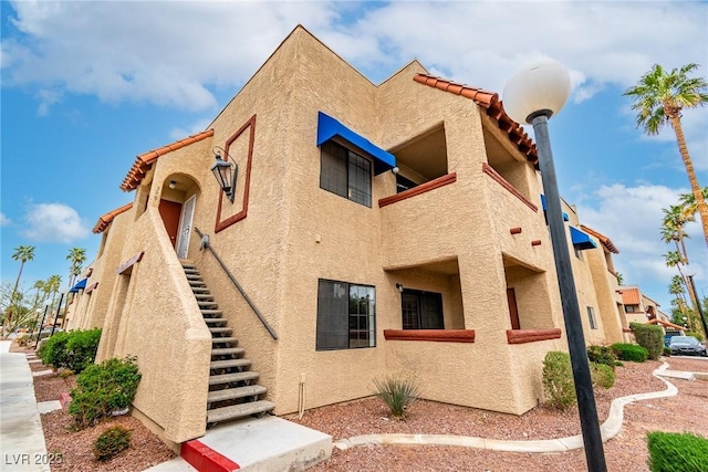 view of property featuring stairway