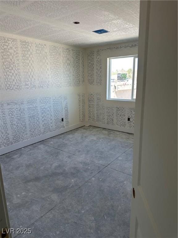 331 Huracan St, Pahrump, NV 89048 - empty room with concrete flooring and a textured ceiling