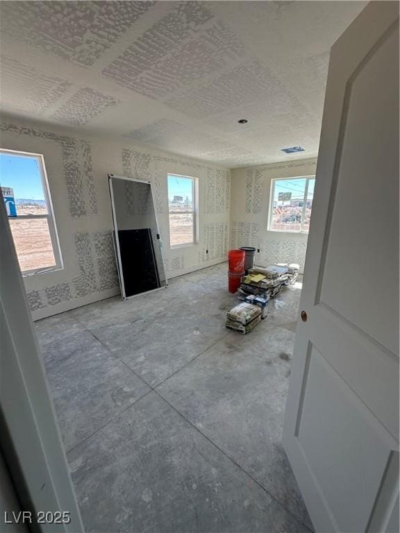 331 Huracan St, Pahrump, NV 89048 - unfurnished living room featuring plenty of natural light and visible vents