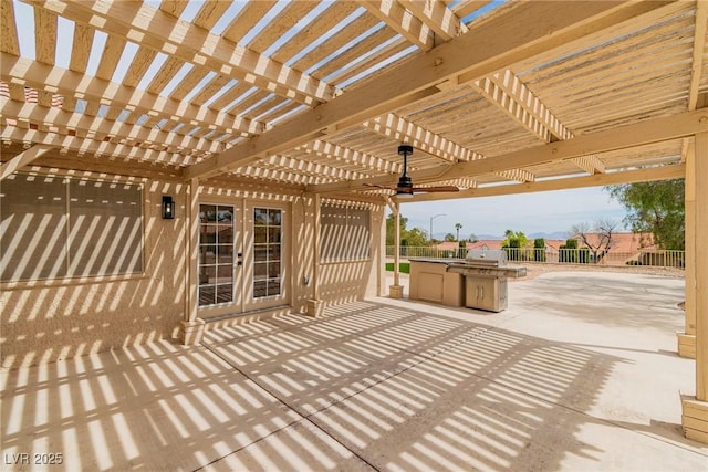 view of patio featuring fence, french doors, and a pergola