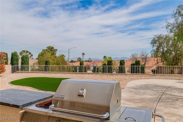view of patio / terrace with a grill and a fenced backyard