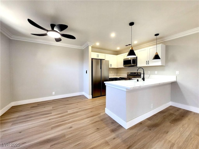 4050 Pacific Harbors Dr Unit 209, Las Vegas, NV 89121 - kitchen with ornamental molding, light wood-type flooring, stainless steel appliances, and a peninsula