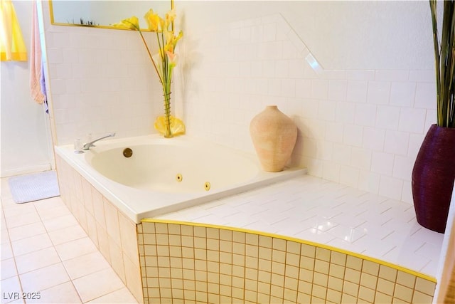 full bath featuring a whirlpool tub and tile patterned flooring