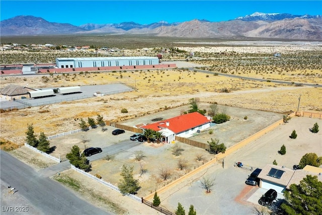 birds eye view of property with a mountain view and a desert view