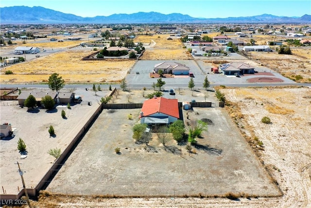 bird's eye view with a mountain view and a desert view