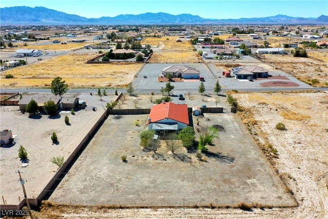 aerial view featuring a mountain view and view of desert