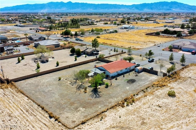 birds eye view of property featuring a mountain view