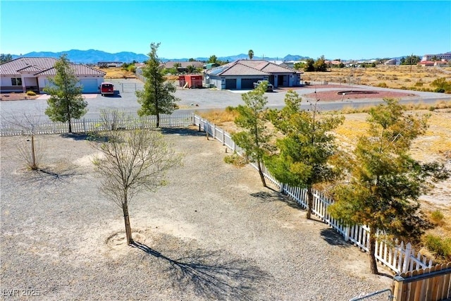 birds eye view of property with a mountain view