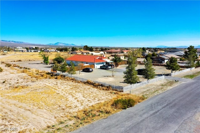 birds eye view of property featuring a mountain view and a residential view