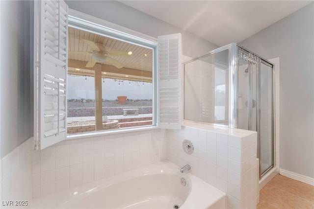 1010 Armillaria St, Henderson, NV 89011 - full bath with tile patterned flooring, baseboards, a shower stall, a ceiling fan, and a bath