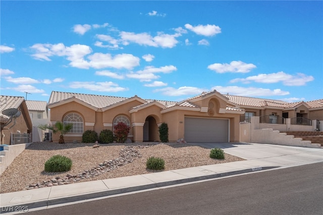 1010 Armillaria St, Henderson, NV 89011 - view of front of home with fence, a garage, concrete driveway, a tile roof, and stucco siding