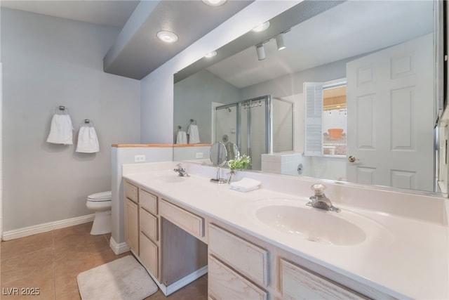 1010 Armillaria St, Henderson, NV 89011 - bathroom featuring tile patterned floors, a sink, a stall shower, and double vanity