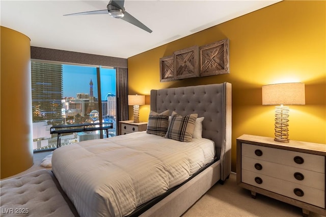 bedroom featuring a ceiling fan and light carpet