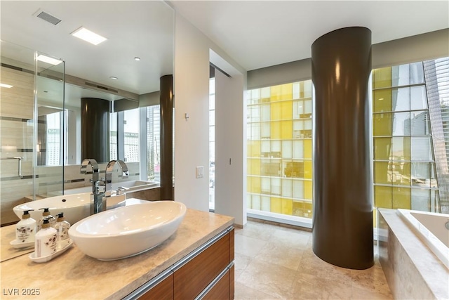 full bathroom featuring tile patterned flooring, vanity, a shower with door, visible vents, and tiled tub