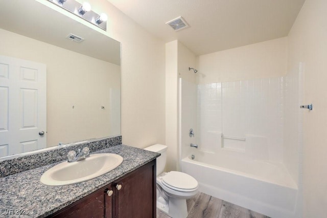4516 Townwall St, Las Vegas, NV 89115 - bathroom featuring toilet, vanity, wood finished floors, and visible vents
