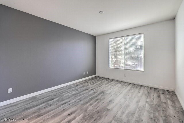 4516 Townwall St, Las Vegas, NV 89115 - unfurnished room featuring baseboards and wood finished floors