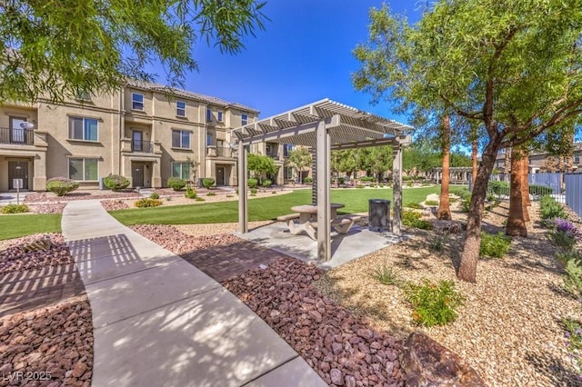 4516 Townwall St, Las Vegas, NV 89115 - surrounding community with a pergola and a yard