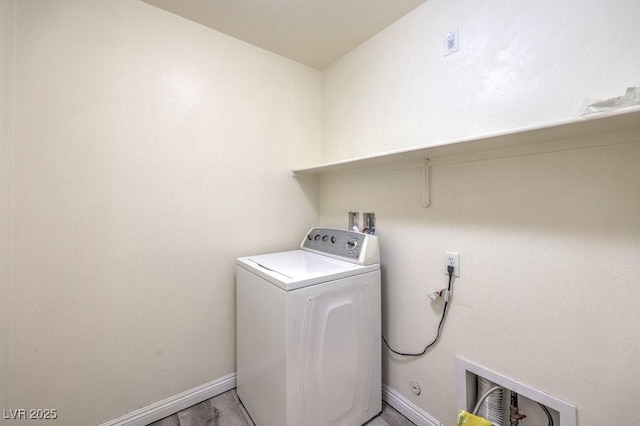 4516 Townwall St, Las Vegas, NV 89115 - clothes washing area featuring light wood finished floors, baseboards, washer / clothes dryer, and laundry area