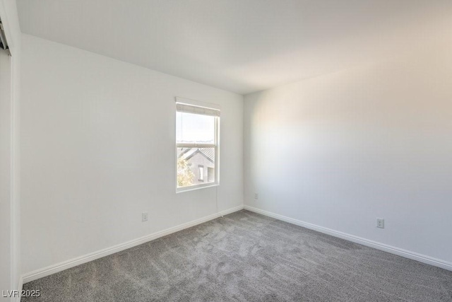 4516 Townwall St, Las Vegas, NV 89115 - carpeted empty room with baseboards