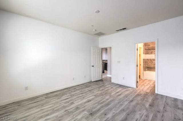 4516 Townwall St, Las Vegas, NV 89115 - unfurnished bedroom with baseboards, visible vents, and light wood-type flooring