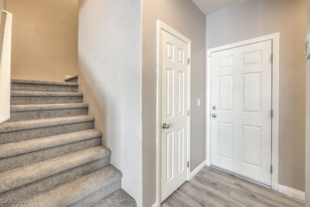 4516 Townwall St, Las Vegas, NV 89115 - stairs featuring baseboards and wood finished floors