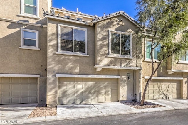 4516 Townwall St, Las Vegas, NV 89115 - multi unit property with a garage and stucco siding
