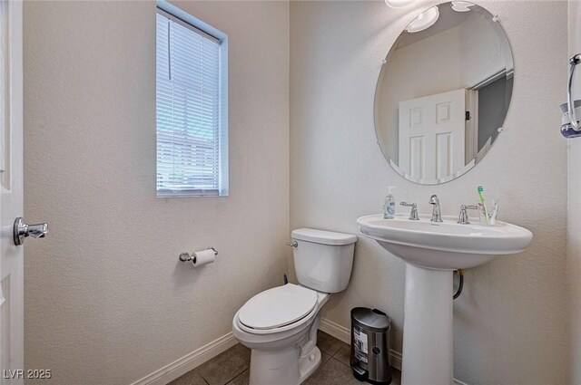 6516 Austin Hope Ave, Las Vegas, NV 89118 - bathroom with tile patterned flooring, toilet, and baseboards