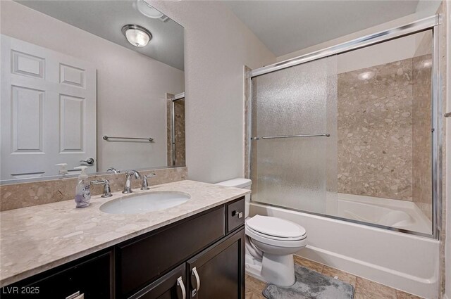 6516 Austin Hope Ave, Las Vegas, NV 89118 - bathroom featuring toilet, vanity, and bath / shower combo with glass door