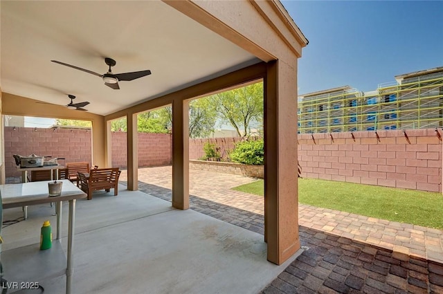 6516 Austin Hope Ave, Las Vegas, NV 89118 - fenced backyard featuring a ceiling fan and a patio area