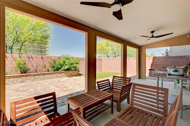 6516 Austin Hope Ave, Las Vegas, NV 89118 - fenced backyard with a ceiling fan and a patio area