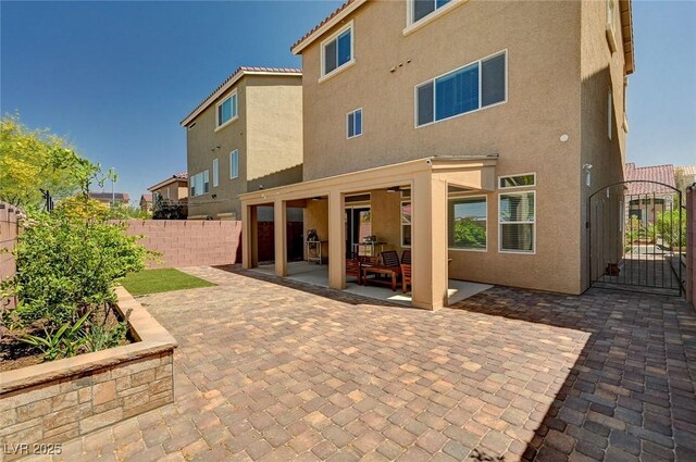 6516 Austin Hope Ave, Las Vegas, NV 89118 - back of house with a fenced backyard, stucco siding, a patio area, and a gate