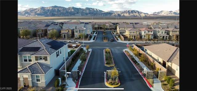 bird's eye view with a residential view and a mountain view