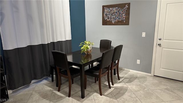 dining area featuring baseboards