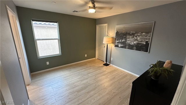 bedroom with a ceiling fan, light wood-style flooring, baseboards, and visible vents